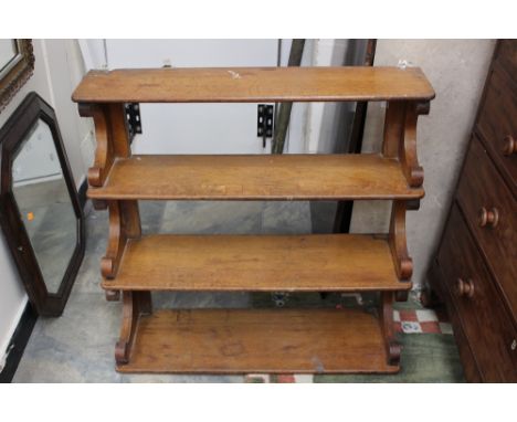 A 19th Century three tier wall hanging mahogany shelf unit, 82cm high, 83cm wide, 27cm deep