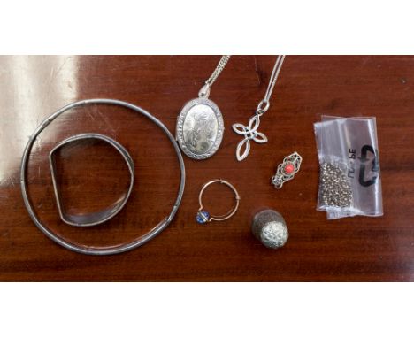 A silver bangle, napkin ring, chain and gold wire ring and silver thimble and pendant/locket and chain, etc (q) 