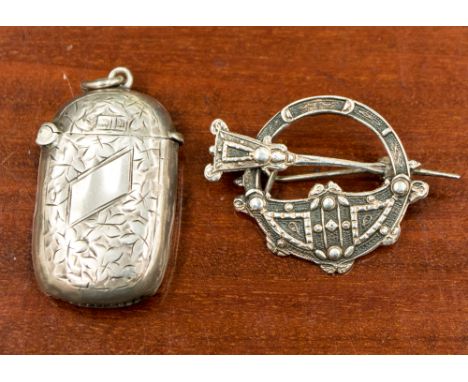 A silver vesta case, Birmingham 1907, together with a Dublin silver sash brooch, 1949, approx weight 19.4gm/0.68ozt (2)