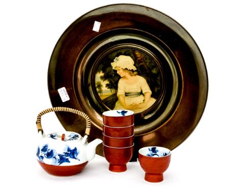 A Japanese boxed set of porcelain cups etc for a 'Tea Ceremony' together with a brass tin plated plaque with a print of 'Simp