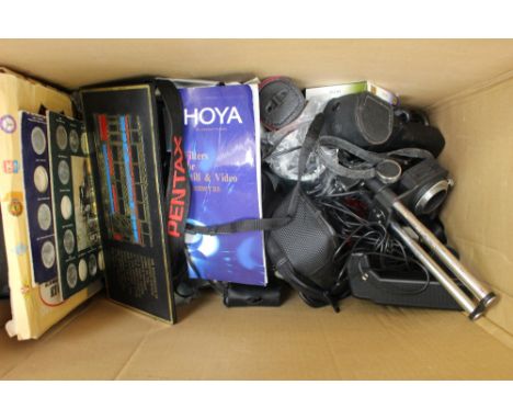 An Amstrad notepad computer, collection of camera lenses etc
