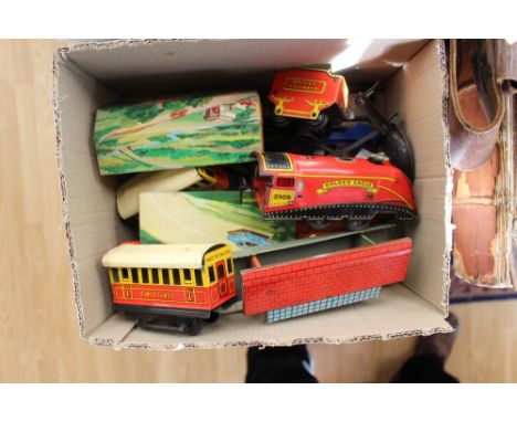 A Wells Of London tin plate, clockwork train set, including Golden Eagle 2509 engine carriages track, platform etc