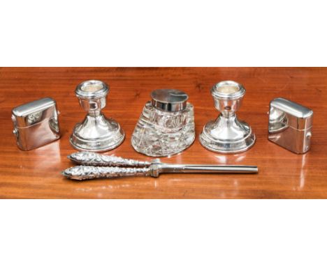 A pair of squat weighted candle holders, weighted bases, 6.8 troy oz/211.9 grams approx. Birmingham 1975, a horse hoof shaped