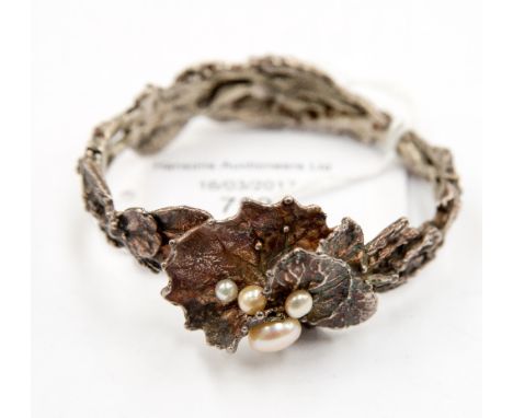 Finish silver (white metal) modernist bangle, knotted bark sample