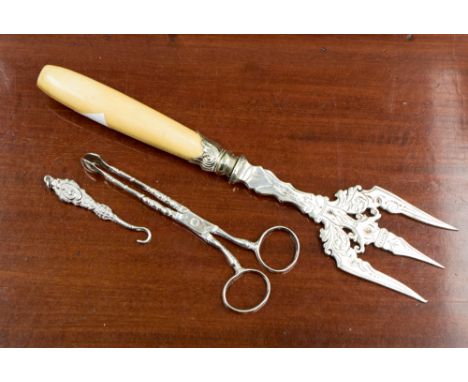 An ivory handled 19th Century white metal bread fork (Indian) a pair of 18th early 19th Century silver sugar nips with stamp 