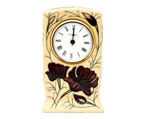 A Moorcroft mantle clock in the 'chocolate cosmos' pattern
