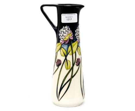 A Moorcroft pitcher in the 'trefoil' pattern, measuring approx 24cm high