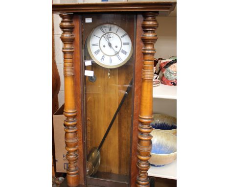 A large mahogany wall clock, white enamel dial