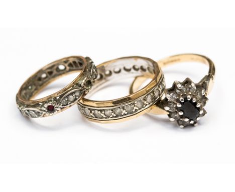 Three 9ct gold and silver rings, comprising two full eternity rings with white stones with a combined aprox gross weight of 5