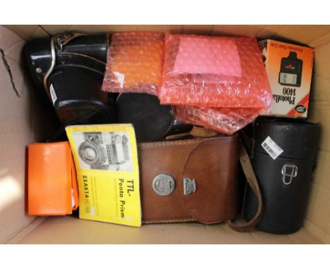 A collection of 35mm camera equipment including EXA, Zenit,m a selection of lenses and other equipment 