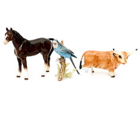 A Sylvac brown Horse No. 3180; together with a Goebel figure of a Parrot and an unmarked figure of a Bull (3) 