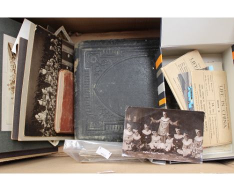 A leather embossed photography album with sepia photographs with a box of loose sepia photographs, post cards etc 