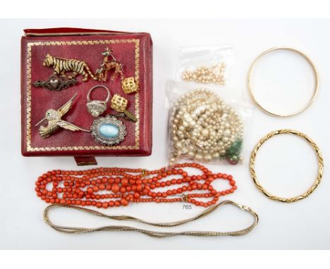 A silver and Majorcan pearl ring; triple string of coral coloured beads; a Bambi brooch; strings of pearls (one with a nine c