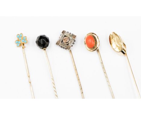 A card of five stick pins 9ct gold, some with semi precious stones 