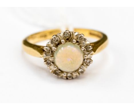 Opal and diamond cluster ring on 18ct gold size N with a total gross weight of 4.7gms