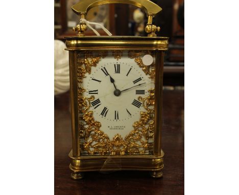 An R.L. Christie Edinburgh carriage clock, gilt filigree overlaid dial 