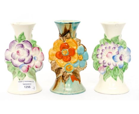 Clarice Cliff for Newport Pottery, a pair of My Garden pattern candlesticks; together with a Wilkinson's Clarice Cliff candle
