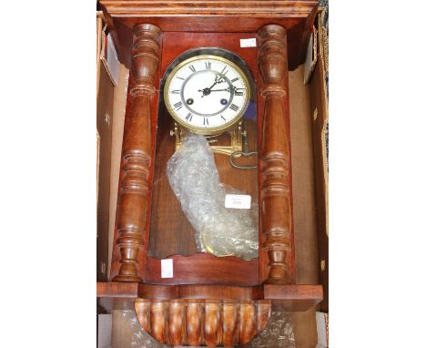 An oak cased Vienna wall clock 