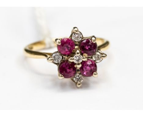 A synthetic Ruby and Diamond flower cluster ring set in 18ct yellow gold size M, approx total gross weight 3.8gms. Head width