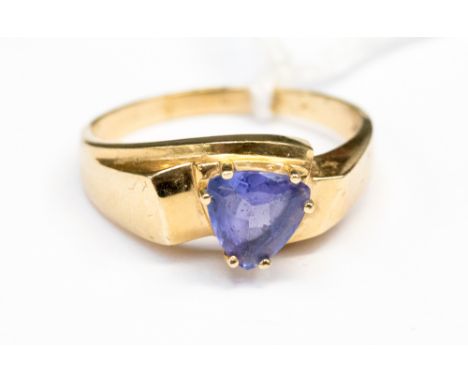 A Tanzanite trilion shape claw set in 14ct gold ring set, size R½ approx total weight 4.1gms 