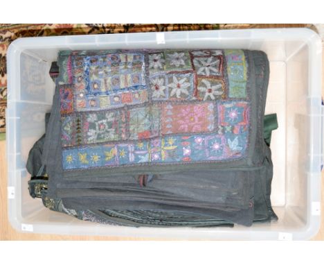 A large collection of Indian cushion covers, heavily beaded and embossed made in India, traditional embroidered dress in dark
