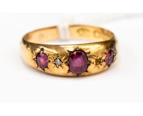 A 3 stone Victorian  Ruby ring set in 18ct yellow gold,  size Q, 2.8 grams gross approx 