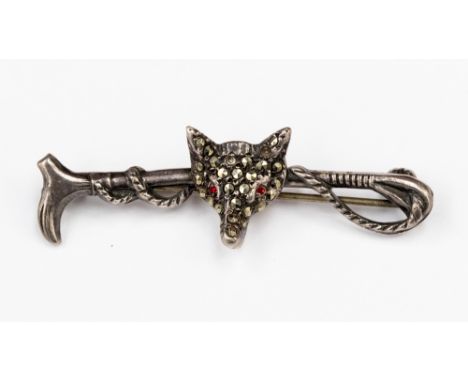 Hunting interest; A silver bar brooch (no Hallmark) no , with a marcasite fox head set with red paste eyes mounted on a hunti