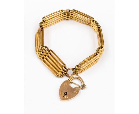 A five bar gate bracelet with heart locket, approx width of 1.3cm and a total weight approx  14.8 grams