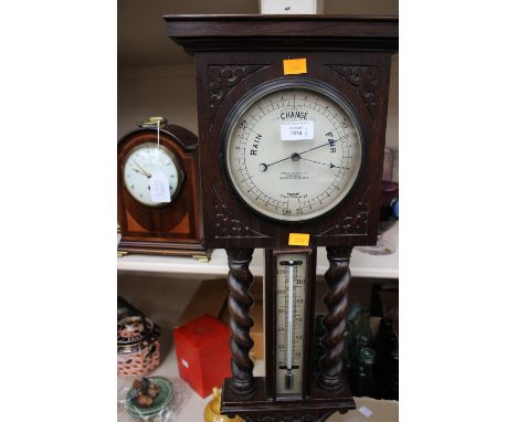 Twist detail oak wall barometer and thermometer by James Lucking & Co, together with Edwardian mahogany mantle clock with sat