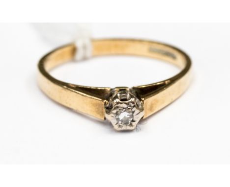 A Diamond illusion set solitaire ring set in 9ct yellow with white gold head, size N, approx total weight1.9gms 