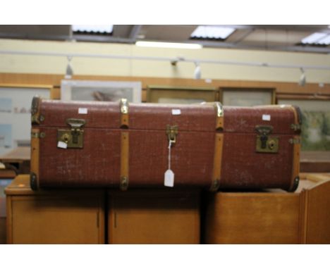 An early 20th Century canvas and beech bound travelling trunk