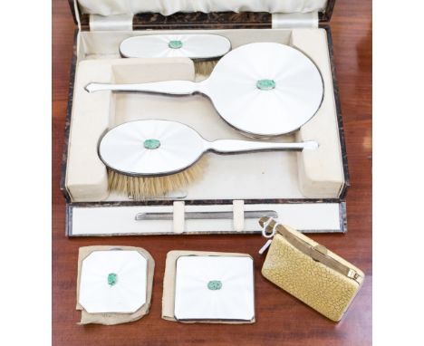 An Art Deco enamelled silver and jade vanity set, including hand mirror (mirror loose), brushes, cigarette case, compact and 