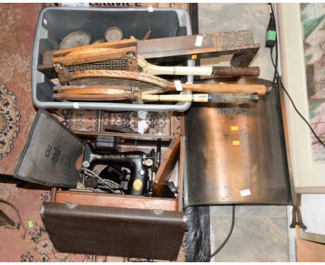 A cased Singer sewing machine, copper fire guards, three vintage tennis rackets, old scales, etc (4) 
