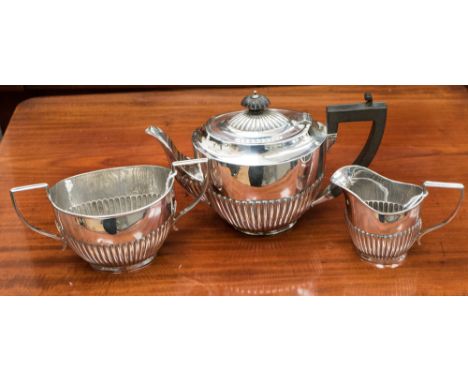 A three piece tea service, the teapot with ebonised handle and finial, Birmingham 1918 & 1919, makers mark indistinct, total 