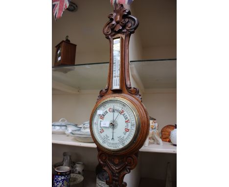 An oak aneroid wheel barometer