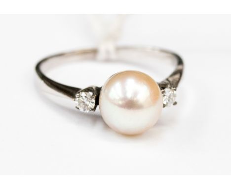 Fresh water cultured pearl and diamond ring approx pearl size 7mm  on a white metal band size M 1/2 total gross weight 2.2gms