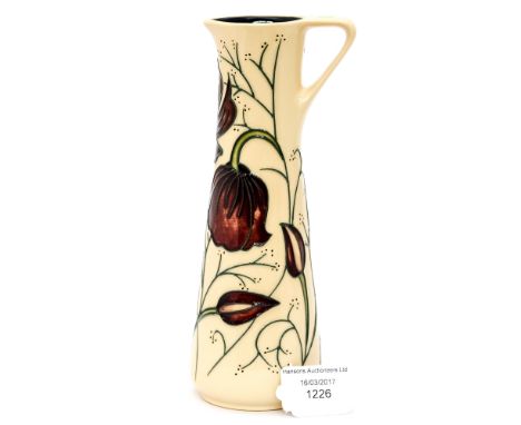 A Moorcroft pitcher in the 'chocolate cosmos' pattern