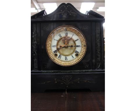 An 8 day striking Ansonia USA mantle clock slate and granite finish, skeleton dial 