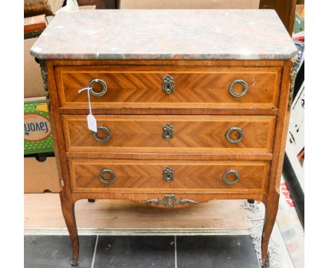 A Louis VI style kingwood and ormolu mounted commode, marble topped, comprising three long drawers