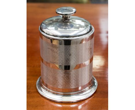 A silver cigarette dispenser in the form of a canister with pull up lid 7.54 troy oz 234.6 grams approx.   Birmingham 1934 en