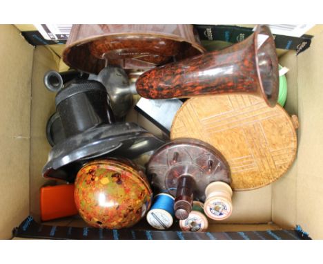 A box of assorted Bakelite including two wool/string dispensers 'housewife', vase, ash tray, desk tidy, pipe/ash tray, vestas