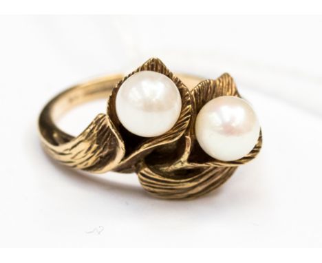 A cultured double Pearl ring set in 9ct gold. Pearls are set into a leaf design with a bark effect. Size N with approx total 