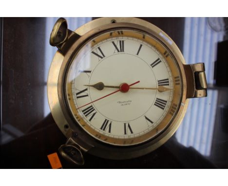 A quartz brass ships style clock, by Nauticalia 
