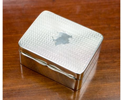 A George V silver patch box, the top with engine turned decoration and a central vacant cartouche, gilt lined interior, maker