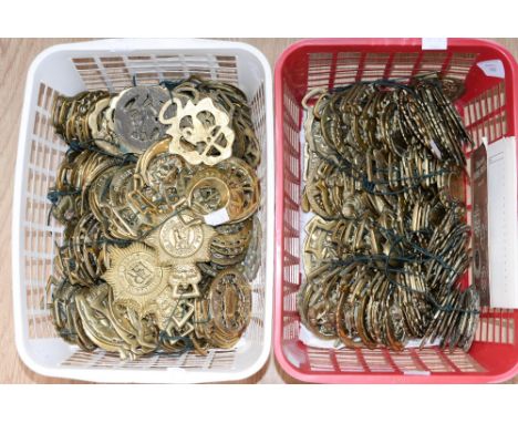 Two crates of assorted horse brasses and John Vine guidebook 