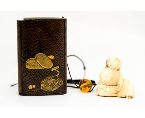 A nineteenth Century netsuke ivory figure and a small box fitted with three internal drawers, meiji period