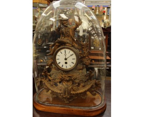 A 19th Century gilt cased mantle clock, with a white enamelled dial, black Roman numerals, complete with a stand and dome 
