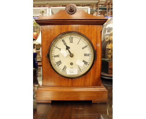 A solid wood cased painted dial table or bracket clock late 19th Century Roman numerals with key 