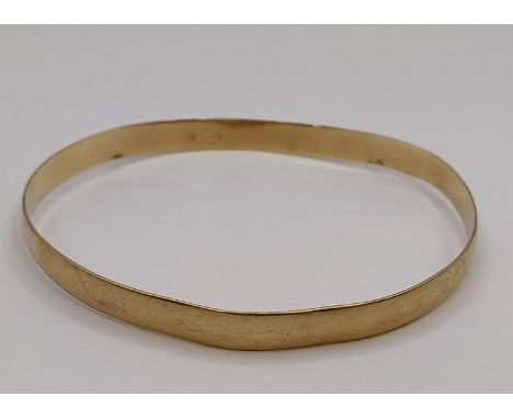 A 9ct gold bangle, 11.1 gBent