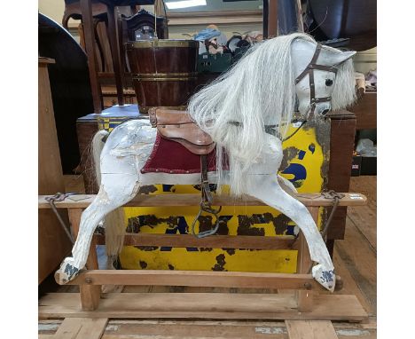 A wooden dapple grey rocking horse, affectionately known as Mabel, 120 cm wideIn need of restoration